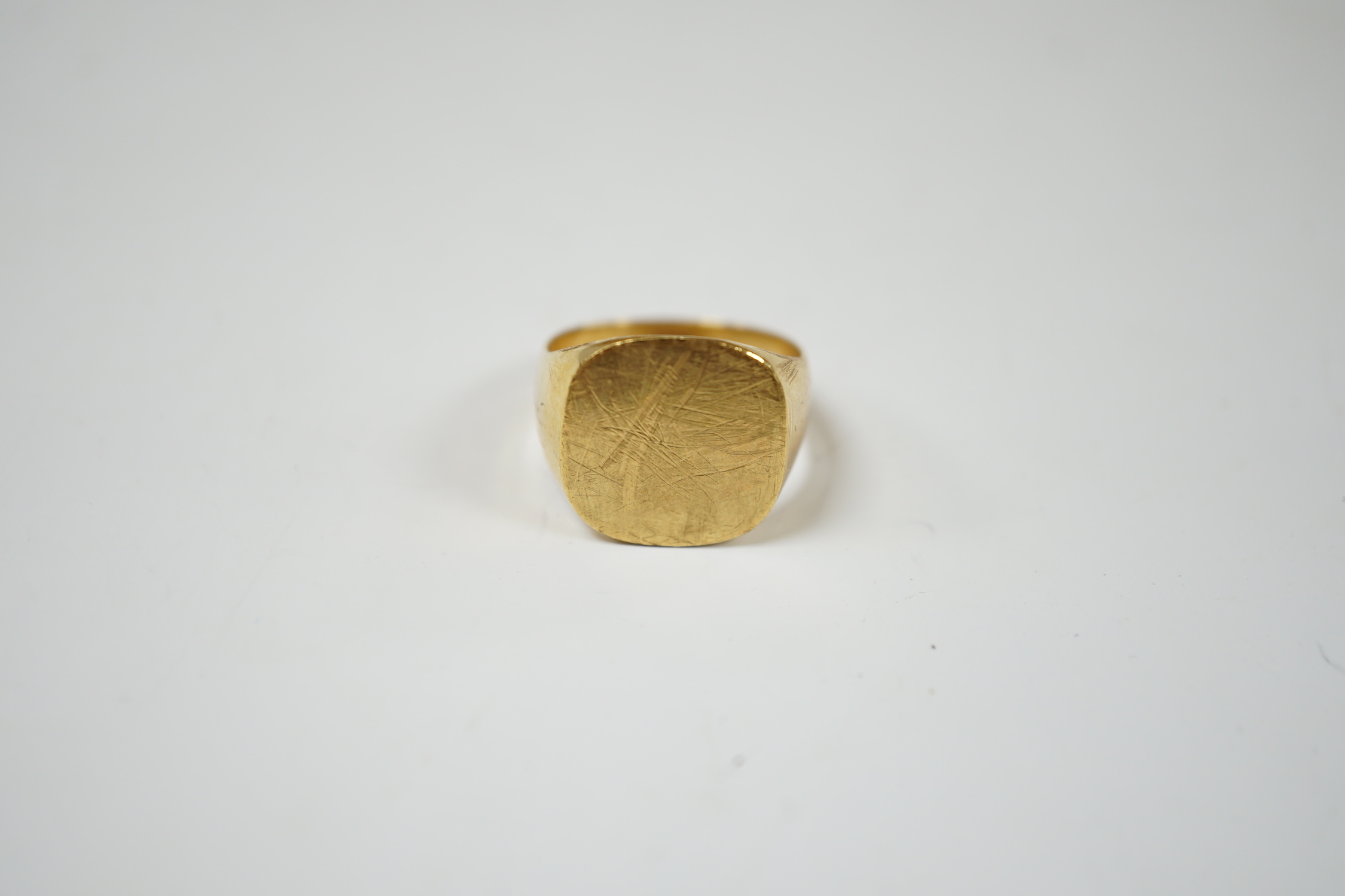 A 750 yellow metal signet ring, size N